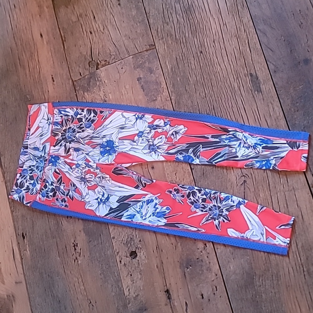 Nike Leggings. Net detail on sides. Medium